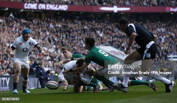 England's Jonny May is denied a try scoring opportunity by Ireland's Conor Murray during the RBS 6 Nations match at Twickenham Stadium, London.