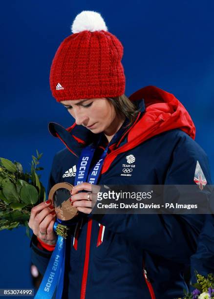 Great Britain Ladies Curling skip Eve Muirhead looks at her medal after being presented with her bronze medal during the 2014 Sochi Olympic Games in...
