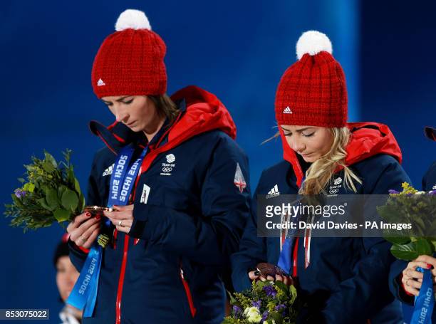 Great Britain Ladies Curling skip Eve Muirhead and Anna Sloan look at their medals after being presented with their bronze medals during the 2014...