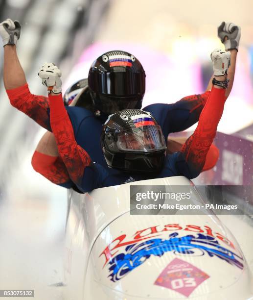 Russia -1 team of Alexander Zubkov , Alexey Negodaylo, Dmitry Trunenkov and Alexey Voevoda celebrate winning gold at the finish of run 6 of the men's...