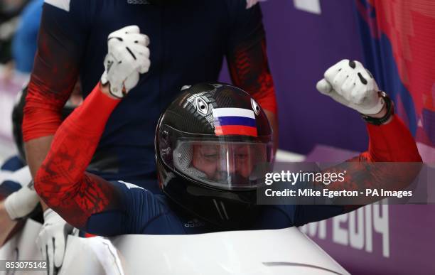 Russia -1 team of Alexander Zubkov , Alexey Negodaylo, Dmitry Trunenkov and Alexey Voevoda celebrate winning gold at the finish of run 6 of the men's...