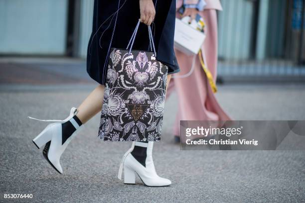 Guest is seen outside Au Jour Le Jour during Milan Fashion Week Spring/Summer 2018 on September 24, 2017 in Milan, Italy.