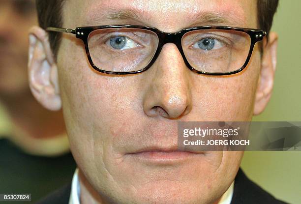 Helg Scarbi, dubbed the "Swiss Gigolo", waits at court for the start of his trial on March 9, 2009 in Munich, southern Germany, where he is accused...