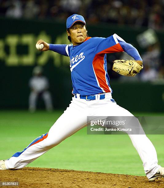 Pitcher Jong Hyun Wook of South Korea throws the pitch of the day to open the World Baseball Classic Pool A Tokyo Round match between South Korea and...