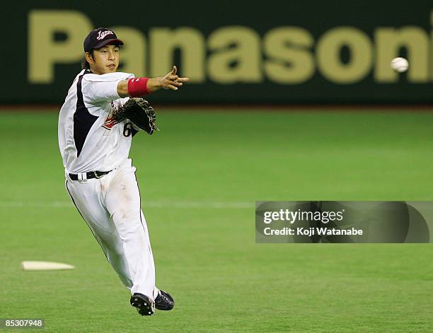 Short stop Hiroyuki Nakajima of Japan fields in the top of fifth inning during the World Baseball Classic Pool A Tokyo Round match between Japan and...