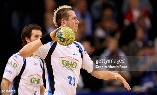 Pascal Hens of Hamburg throws the ball during the Bundesliga match between HSV Hamburg and TV Grosswallstadt at the Color Line Arena on March 7, 2009...