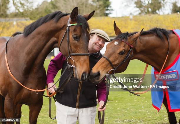 Trainer Nicky Henderson with My Tent or Yours and Bobs Worth during a stable visit at Seven Barrows, Lambourn.