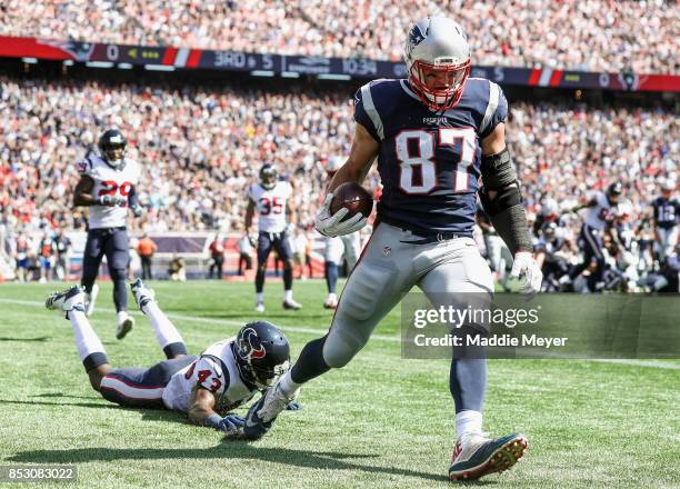Corey Moore of the Houston Texans cannot defend Rob Gronkowski of the New England Patriots as he catches a touchdown pass during the second quarter...