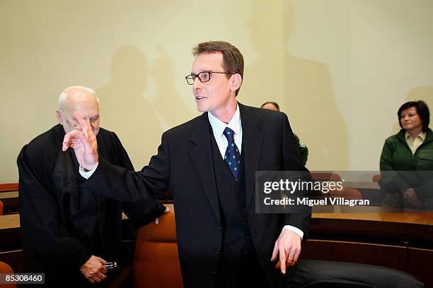 Helg Sgarbi and his German lawyer Egon Geis react prior to the verdict at the country court on March 9, 2009 in Munich, Germany.Sgarbi has been...