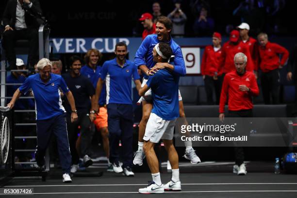 Roger Federer of Team Europe celebrates with Rafael Nadal of Team Europe after winning the Laver Cup on match point during his mens singles match...