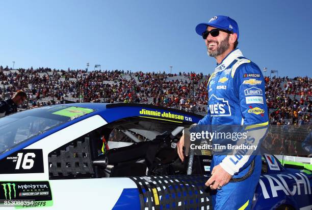 Jimmie Johnson, driver of the Lowe's Chevrolet, stands on the grid prior to the Monster Energy NASCAR Cup Series ISM Connect 300 at New Hampshire...
