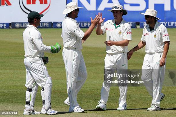 Mark Boucher, Jacques Kallis, AB de Villiers and Neil McKenzie of South Africa celebrate the wicket of Marcus North during day four of the Second...