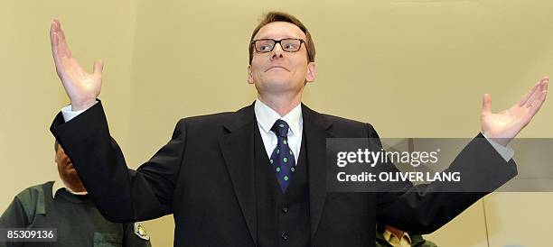 Helg Scarbi, dubbed the "Swiss Gigolo", gestures as he waits for his judgement at court during his trial on March 9, 2009 in Munich, southern...