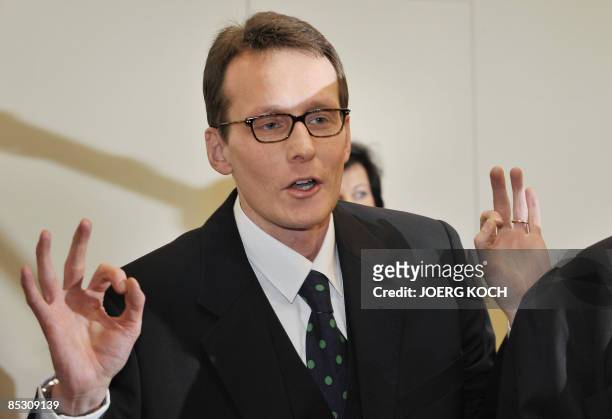 Helg Scarbi, dubbed the "Swiss Gigolo", gestures as he waits for his judgement at court during his trial on March 9, 2009 in Munich, southern...