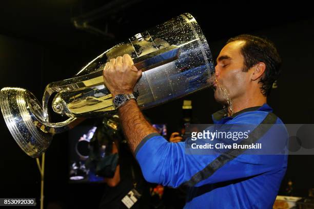 Roger Federer of Team Europe drinks champagne from Laver Cup trophy after winning the Laver Cup on the final day of the Laver cup on September 24,...