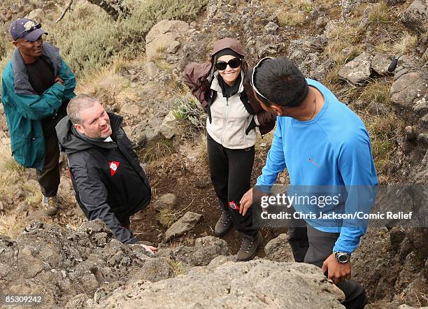 Chris Moyles and Cheryl Cole prepare to climb up a steep bit of path on the second day of The BT Red Nose Climb of Kilimanjaro on March 1, 2009 in...