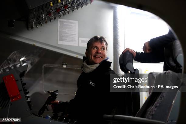 Iron Maiden front man Bruce Dickinson inside the cockpit of the world's largest aircraft known as the HAV304 at its launch at Cardington Hanger in...