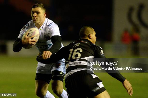 Huddersfield Giants Danny Brough is tackled by Widnes Vikings Willie Isa, during the First Utility Super League match at the Select Security Stadium,...