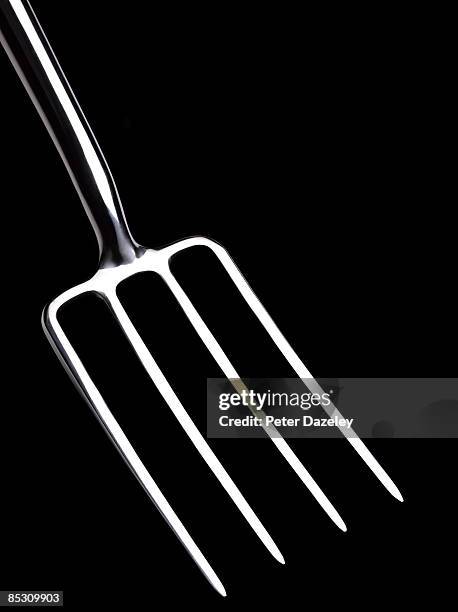 garden fork on black background. - pitchfork agricultural equipment stock pictures, royalty-free photos & images