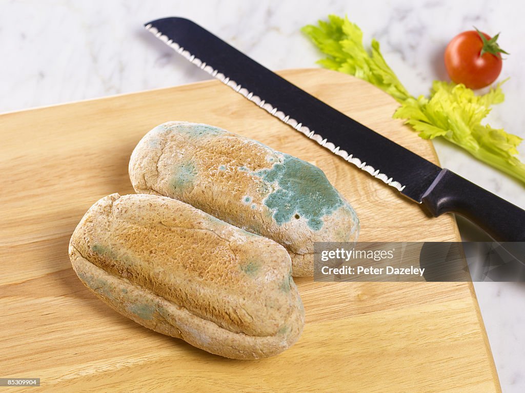 Brown bread rolls with mould.