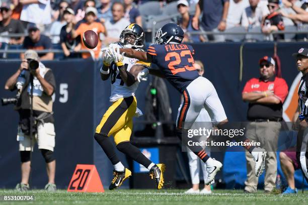 Pittsburgh Steelers wide receiver Antonio Brown battles with Chicago Bears cornerback Kyle Fuller for a pass during an NFL football game between the...