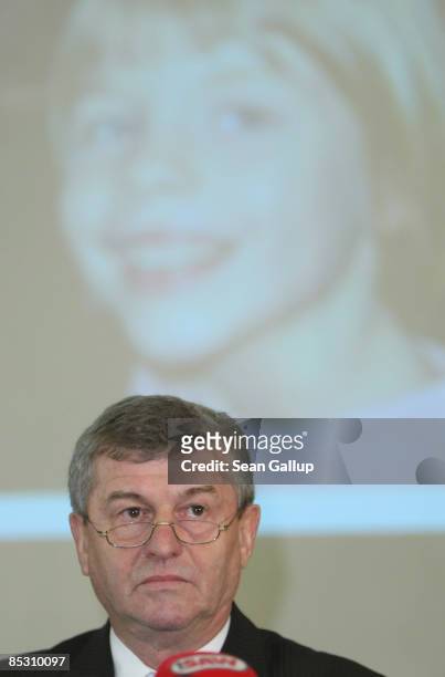 Albrecht Buttolo, Minister of Interior for the state of Saxony, arrives for a press conference under a portrait of murdered child Michelle at police...