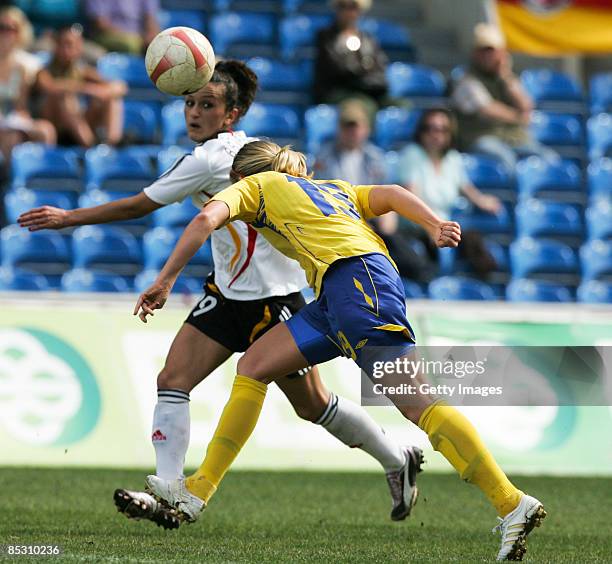 Linda Sembrandt from Sweden competes for the ball with Fatmire Bajramaj from Germany during the Women Algarve Cup match between Germany and Sweden at...