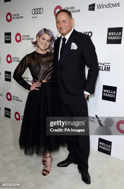 Kelly Osbourne and John Dempsey arrive for the Elton John AIDS Foundation's 22nd annual Academy Awards Viewing Party at West Hollywood Park in Los...