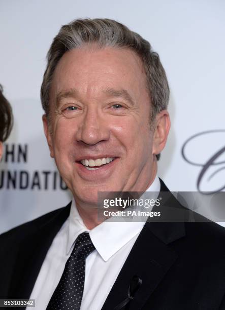 Tim Allen arrives for the Elton John AIDS Foundation's 22nd annual Academy Awards Viewing Party at West Hollywood Park in Los Angeles.