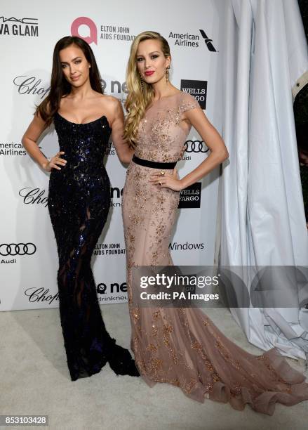 Irina Shayk and Petra Nemcova arrive for the Elton John AIDS Foundation's 22nd annual Academy Awards Viewing Party at West Hollywood Park in Los...