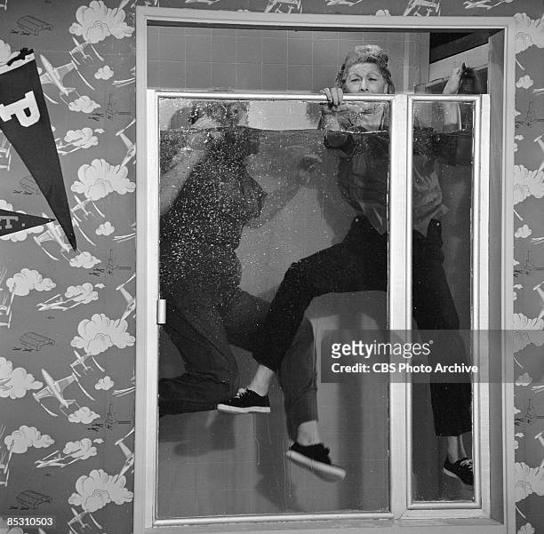 American actress and comedienne Lucille Ball , as Lucille Carmichael, and Vivian Vance , as Vivian Bagley, float in a shower stall full of water in a...
