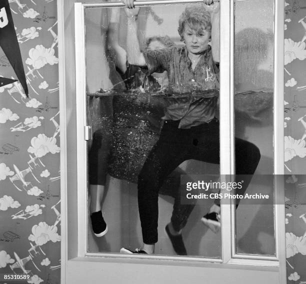 American actress and comedienne Lucille Ball , as Lucille Carmichael, and Vivian Vance , as Vivian Bagley, float in a shower stall half full of water...