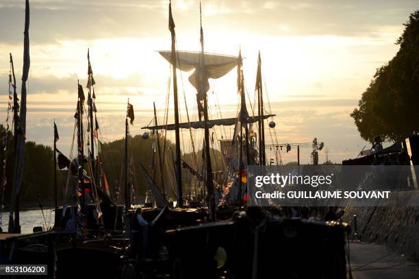 Picture taken at sunset on September 24, 2017 shows boats during "Loire festival", the biggest gathering of river navigation along the Loire in...