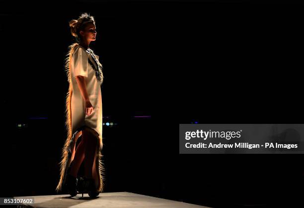 Model showcases Textile Design students work during the Glasgow School of Art Fashion Show 2014, Glasgow.