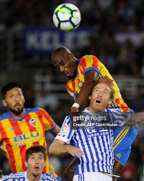 Valencia's midfielder from France Geoffrey Kondogbia vies with Real Sociedad's midfielder from Spain David Zurutuza during the Spanish league...