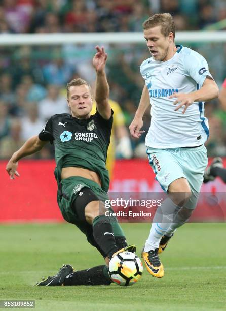 Viktor Claesson of FC Krasnodar is challenged by Aleksandr Kokorin of FC Zenit St. Petersburg during the Russian Premier League match between FC...