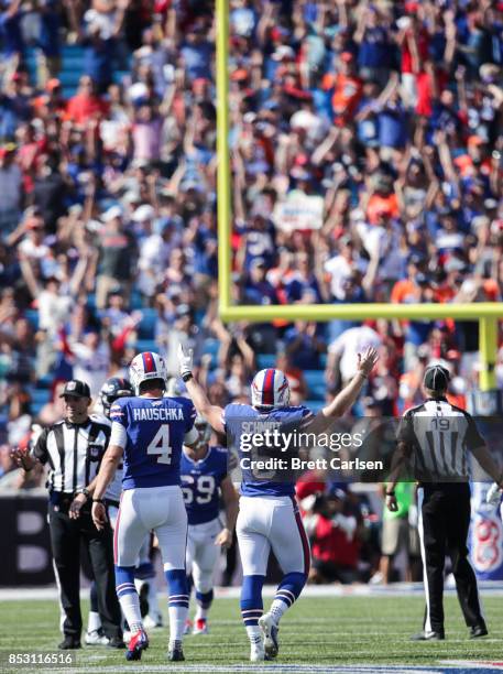 Colton Schmidt of the Buffalo Bills celebrates after Stephen Hauschka of the Buffalo Bills made a field goal during the second half of an NFL game...