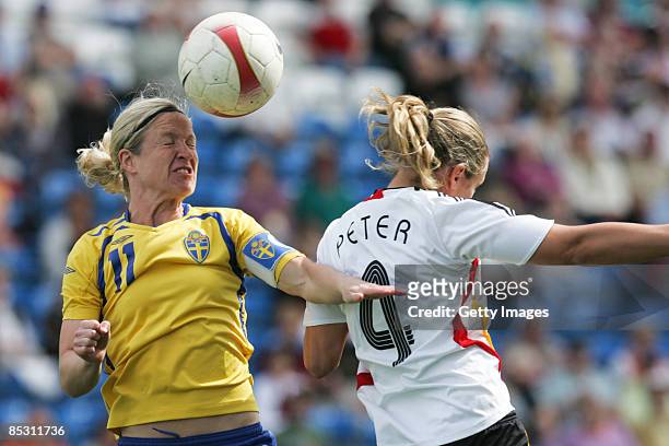 Victoria Svensson and Babett Peter in action during the Women's Algarve Cup match between Germany and Sweden at the Algarve stadium on March 9, 2009...