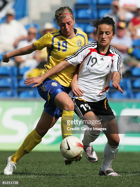 Fatmire Bajramaj and Linda Sembrandt in action during the Women's Algarve Cup match between Germany and Sweden at the Algarve stadium on March 9,...