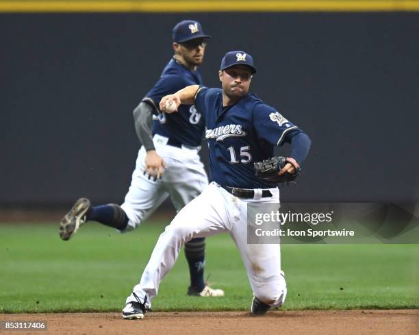 Milwaukee Brewers second baseman Neil Walker throws to first base during a game between the and the Chicago Cubs the Milwaukee Brewers on September...