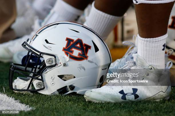 Auburn Tigers football helmet rests at the feet of a player during the second half of a college football game against the Missouri Tigers, Saturday,...