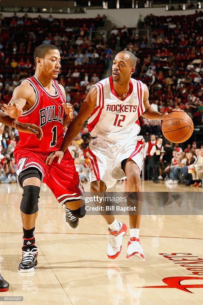 Alll Fire Houston Rockets Rafer Alston of the Houston Rockets drives the ball against Derrick ...