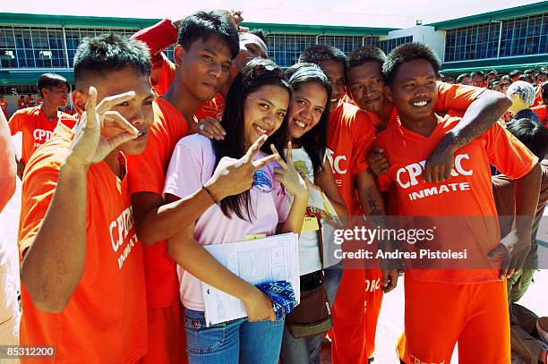 Inmates pose with visitors, after dancing at CPDRC Prison. The Inmates Dance Training & Show is a rehabilitation program at the prison that has...