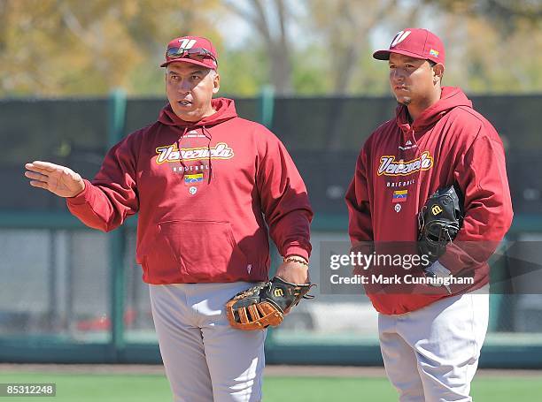 Andres Galarraga and Miguel Cabrera of Team Venezuela look on before the exhibition spring training game against the Detroit Tigers at Joker Marchant...