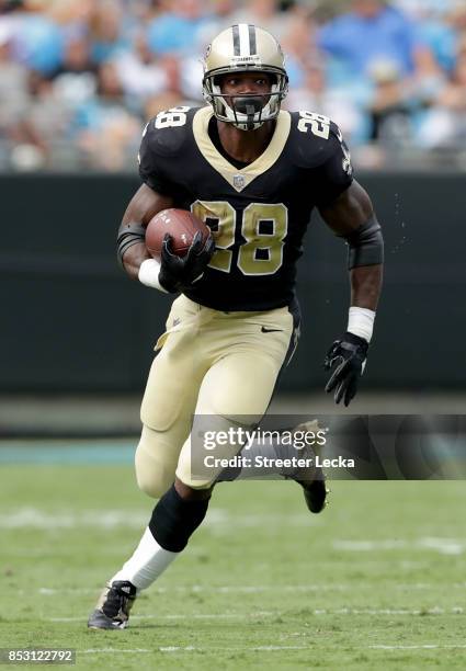 Adrian Peterson of the New Orleans Saints runs with the ball against the Carolina Panthers during their game at Bank of America Stadium on September...