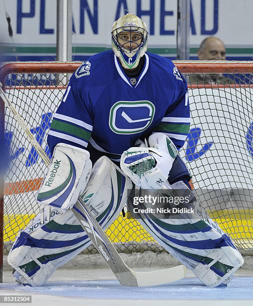 Roberto Luongo of the Vancouver Canucks looks on during pregame warmups before the game against the San Jose Sharks on March 7, 2009 at General...