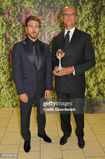 Paolo Zegna , winner of the Eco Stewardship award, poses with presenter Alessandro Roja backstage at The Green Carpet Fashion Awards, Italia, at...