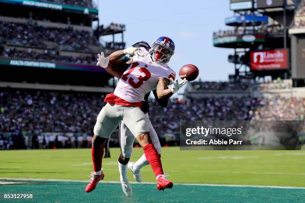 Odell Beckham of the New York Giants completes a four yard touchdown pass against Jalen Mills of the Philadelphia Eagles on September 24, 2017 at...