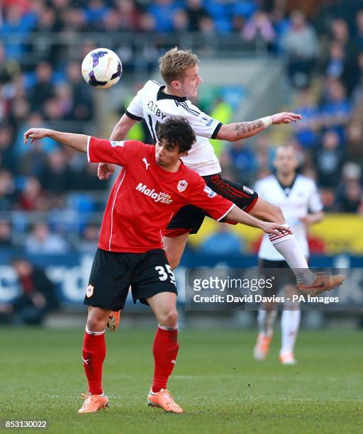 Cardiff City's Fabio Da Silva and Fulham's Lewis Holtby battle for the ball