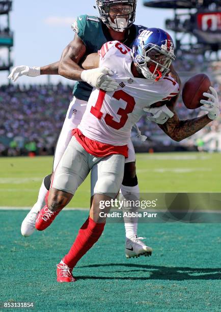 Odell Beckham Jr. #13 of the New York Giants completes a four yard touchdown catch against Jalen Mills of the Philadelphia Eagles in the third...